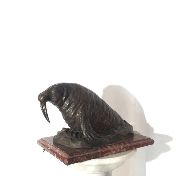 Bronze Walrus Sculpture on Red Marble